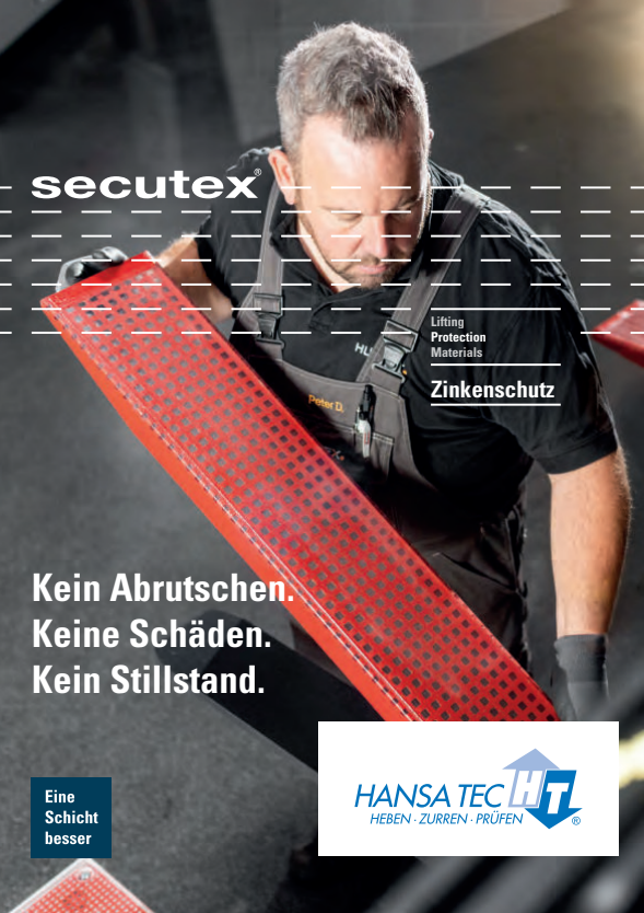 Ein konzentrierter Arbeiter in schwarzer Kleidung haelt einen roten Zinkenschutz